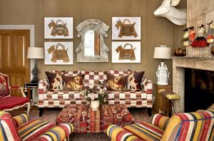 a living room with two couches and a fireplace at Knightsbridge Hotel, Firmdale Hotels in London