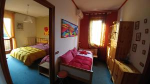 A bed or beds in a room at Le Magnolie B&B
