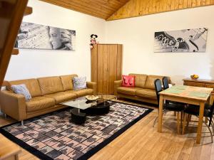 a living room with a couch and a table at Bella Patria in Rozwadza