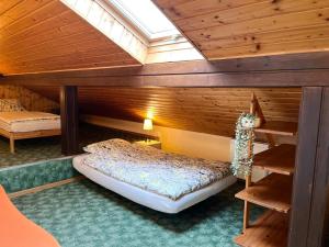 a bedroom with a bunk bed in a wooden cabin at Bella Patria in Rozwadza