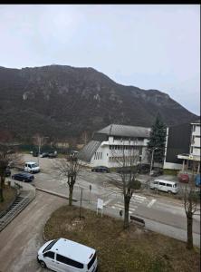 a white van parked in a parking lot in front of a building at Apartment Đina in Plužine
