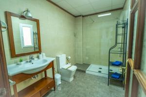 a bathroom with a sink and a toilet and a mirror at Edificio Prieto VIV 2A in Puerto del Rosario +33 photos