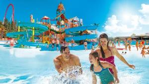 a group of people in the water at a water park at Appartamento Camelia vista mare in Lido Adriano