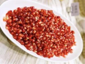 a plate of red beans on a table at Atour Hotel Dalian Development Zone Jinma Road in Dalian +85 photos