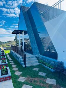 a building with a staircase with a glass wall at SkyGrove in Kodaikānāl