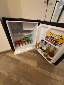 an open refrigerator filled with food and drinks at Montis Resort in Yeghegis