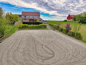 an empty road in front of a house at L'Agolum - B&B Baisy-Thy in Genappe