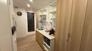 a kitchen with a sink and a counter top at La Divina Commedia in Florence