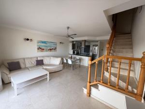 a living room with a couch and a table at Mogán suite in Puerto de Mogán