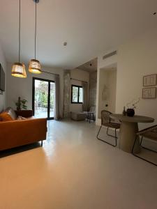 a living room with a couch and a table at Hotel Avenida in Zaragoza