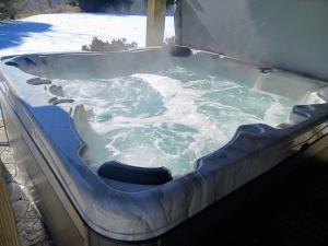 a jacuzzi tub with snow in it at Westcott House- Privacy, amenities and space all in one beautiful package! in Luray