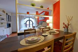 a kitchen and dining room with a table and chairs at Maison Clocher in Pré-Saint-Didier