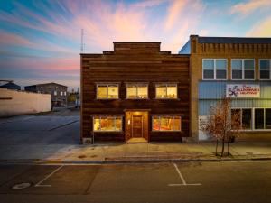 a building with its door open on a street at Historic Yellowstone Saloon in Ashton