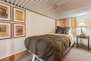 a bedroom with a bed in a room with posters at Historic Yellowstone Saloon in Ashton