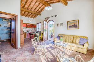 a living room with a couch and a table at Agriturismo Rebarco in Borsecchio