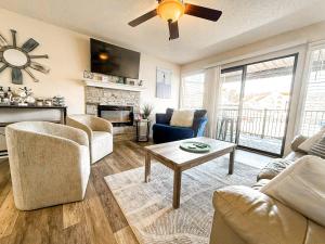 a living room with a couch and a table at Blueys Lakefront 2 Bed and 2 Bath Condo in Abbeyville