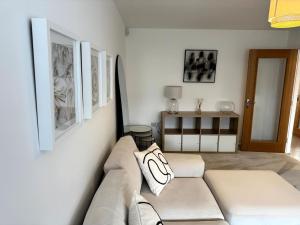 a living room with a couch and a table at Luxury 4BR Detached Exec Home in Cadzow