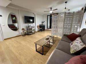 a living room with a couch and a table at Almamater salamanca in Salamanca