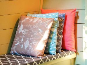 three pillows sitting on top of a bench at Bluebelle - Ukc5928 in Highclere