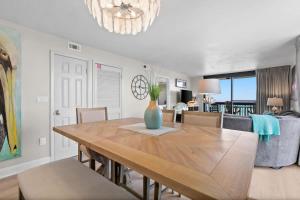 a dining room with a table with a vase on it at SunDestin Resort Unit 1018 in Destin