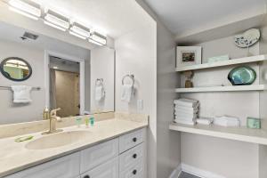 a bathroom with a sink and a mirror at SunDestin Resort Unit 1018 in Destin