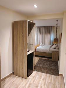 a bedroom with a bed and a large wooden partition at Nubian Hotel in Cairo