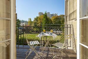 a table and chairs on a balcony with a view at 1 Bed in Bath oc-bhr33 in Bath