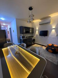 a kitchen and living room with a table and chairs at بورتو سخنه in Ain Sokhna