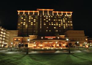 a large building with lights on it at night at Thunder Valley Casino Resort in Lincoln