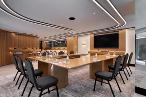 a conference room with a large table and chairs at The Stanley in Athens