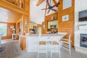 a kitchen with a large white island in a room at Just For Fun - Duck, Schooner Ridge, Pool Open 4/15, Pool Heat Option, Hot Tub, Close to Downtown in Duck