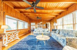 a living room with couches and a ceiling fan at Gypsea Rose - Southern Shores, Oceanfront, Ocean View, Hot Tub, Pets OK, Flex Stays in Southern Shores