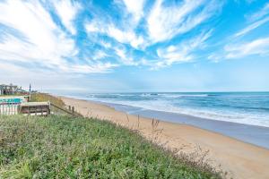 a view of a beach with the ocean at Gypsea Rose - Southern Shores, Oceanfront, Ocean View, Hot Tub, Pets OK, Flex Stays in Southern Shores