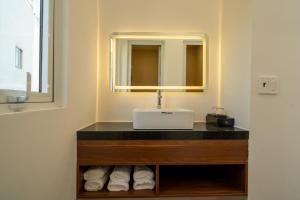 a bathroom with a sink and a mirror at Hotel Thanh Van 2 in Tuy Hoa +37 photos