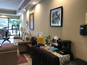 a living room with a table with a blender on it at GreenTree Inn & Suites Los Angeles - Alhambra - Pasadena in Alhambra