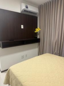 a bedroom with a bed and a air conditioner at Hotel dos Reis in Belém