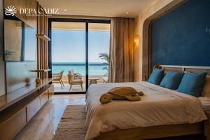 a bedroom with a teddy bear laying on a bed at Departamento Cadiz in Miramar
