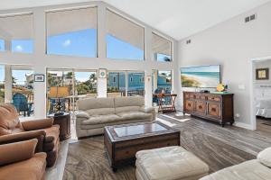 a living room with a couch and a table at Sea-Esta in Destin