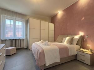 a bedroom with a large bed in a room at Suite Prisma - Modern & Spacious Apartment near Verona Fair in Verona