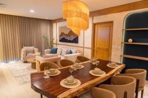 a living room with a wooden table and chairs at Departamento Cadiz in Miramar +14 photos