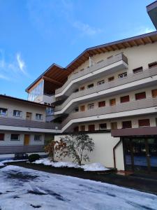 a large building with snow in front of it at Bergblick 33 in Plaus