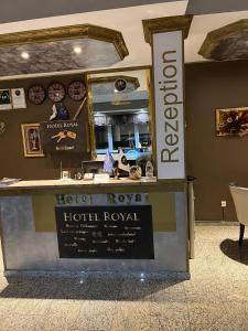 a hotel lobby with a hotel norwegianorth royal sign at Hotel Royal in Bad Salzuflen