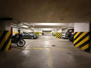 a parking garage with cars parked in it at Austral Express in Comodoro Rivadavia
