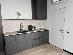 a kitchen with a sink and a counter top at Bavaro apartments 2 in Ivano-Frankivsk