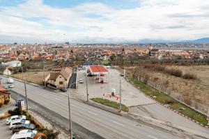 an aerial view of a city with a street at New Airport Apartment in Sibiu