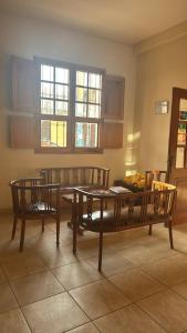a living room with a table and a couch at Hotel La Casona in Pisco