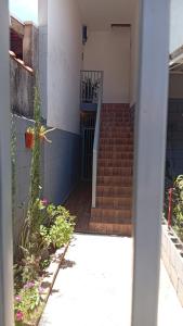 a stairway leading into a building with a gate at Kitnet Imigrantes in Holambra