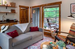 a living room with a couch and a table at Backwoods Cabins in Carson