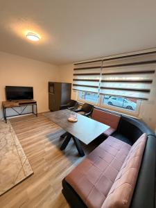 a living room with a couch and a table at WorkHome A2 zu 3 in Lünen