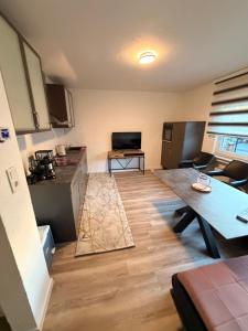 a kitchen and living room with a table and a counter at WorkHome A2 zu 3 in Lünen